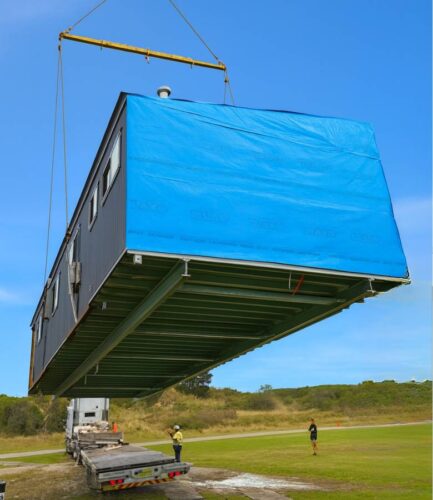 Prime Portables, safely putting a brand now modular home into position.